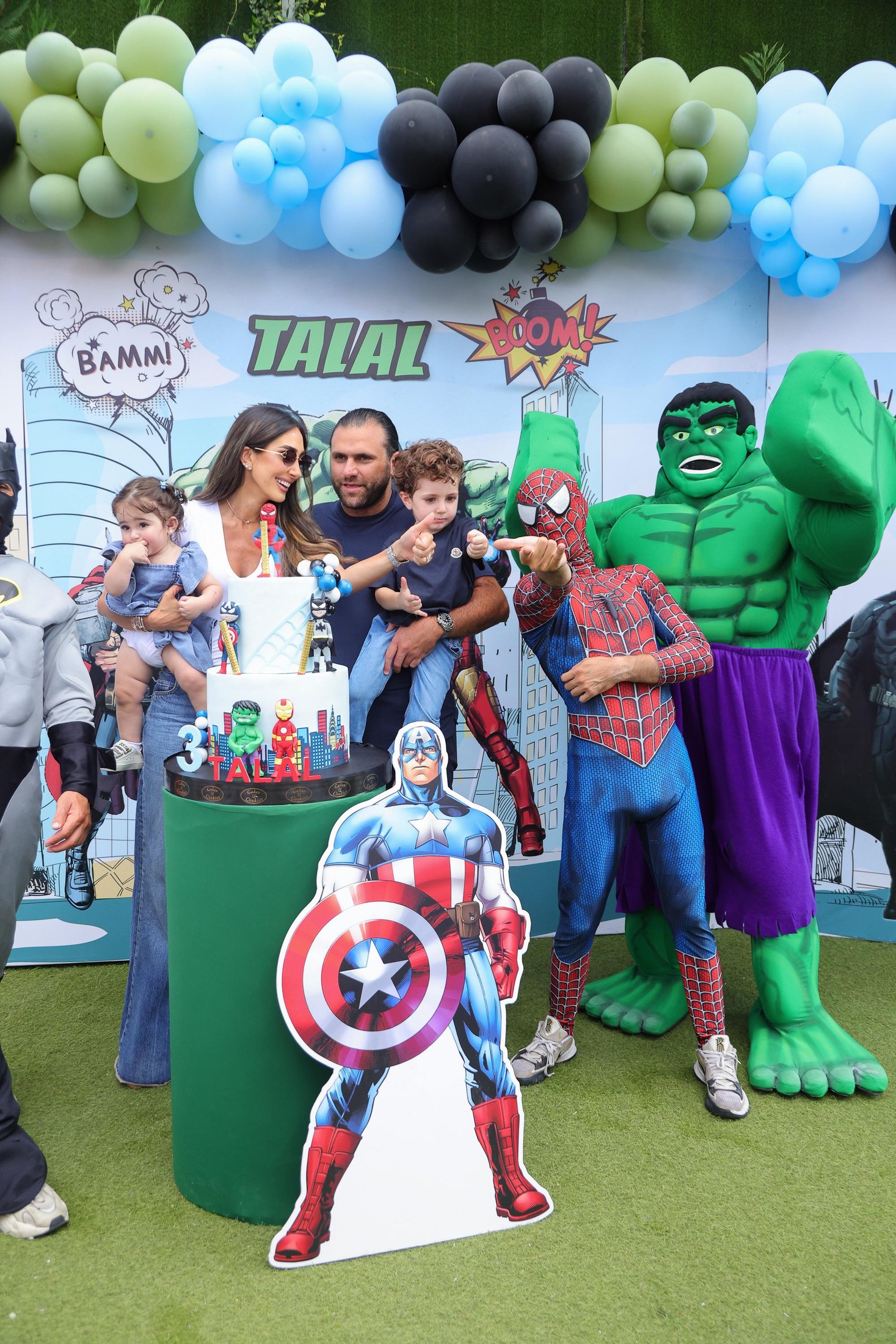 A Recreo birthday celebration with superhero characters and family photo energy