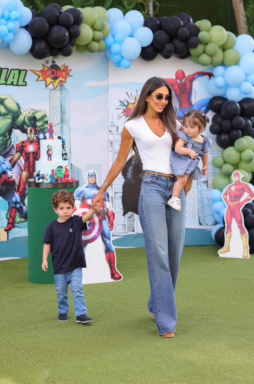 A family walking through a colorful Recreo birthday setup